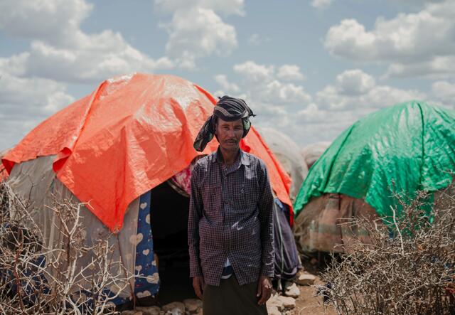 Makus, 63, stands outside his tent at Daryel Shabellow IDP camp.