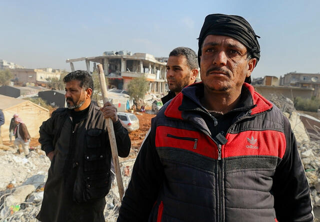 A Syrian man, Omar (not his real name) stands in the cold speaking about losing his sons and home in the Feb. 6, 2023 earthquake.