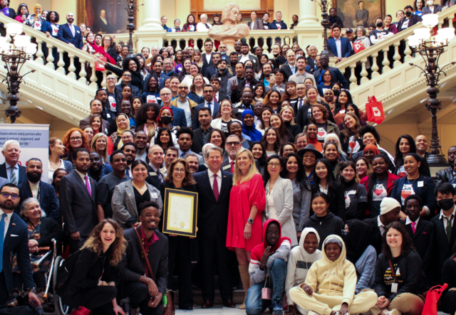 A photo of the 300 New Americans Celebration 2023 on the North steps of Georgia's State Capitol with Governor Brian Kemp.