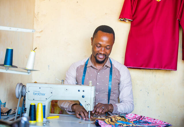 Patrick Sudi makes a shirt in a Kampala-based tailor workshop.