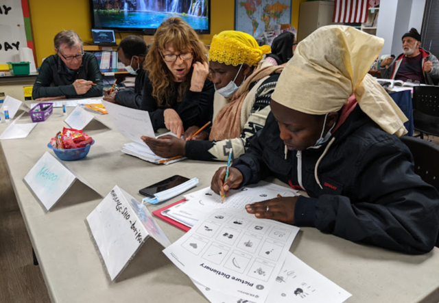 A group of adult education students studying together.