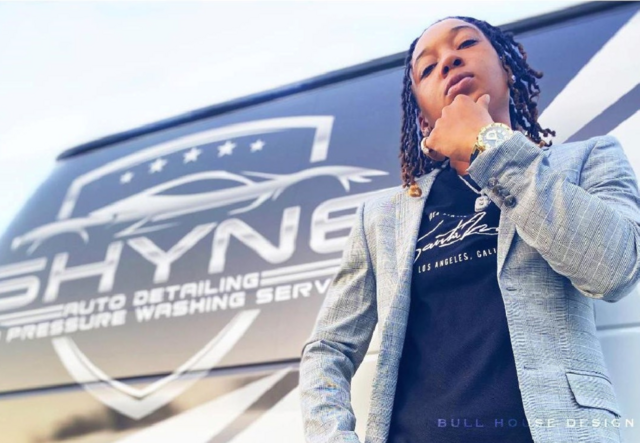 Brittney Cooper standing in front of a Shyne Auto Detail business van.