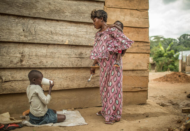 Kahambu Kiyora Eugenie, 22, with her children.