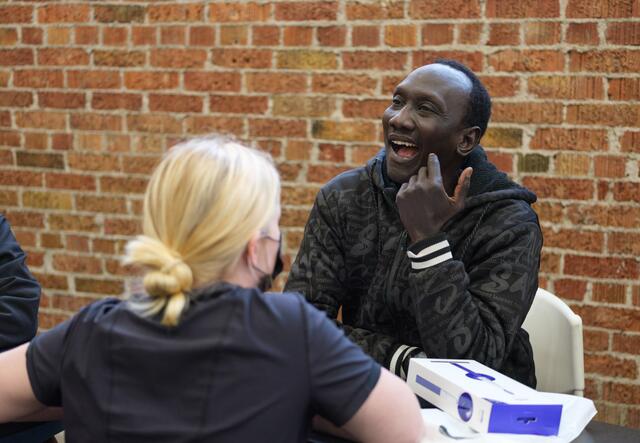 Refugee man opening his mouth at U of U Dentistry clinic