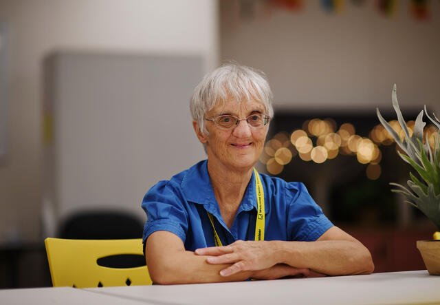 Sister Liane sitting at the Welcome Center conference room.