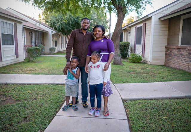 The Sebatware family poses for a picture outside their home in Phoenix, Arizona.