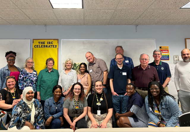 A group photo of IRC Atlanta volunteer brunch attendees.
