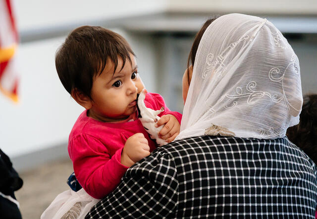 Afghan woman holding her baby