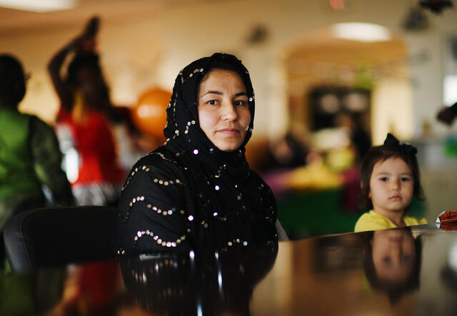 IRC Afghan client attends Halloween party with her daughter.