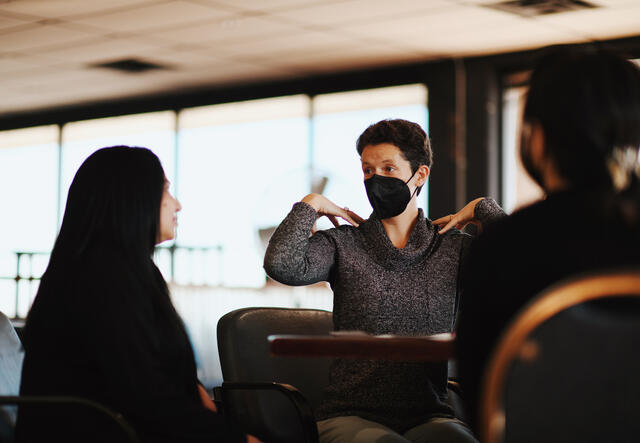 Mental Health Specialist having a group session where she talks about how one can manage their stress.