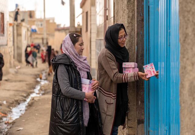 Blossom Pads handing out products in Afghanistan