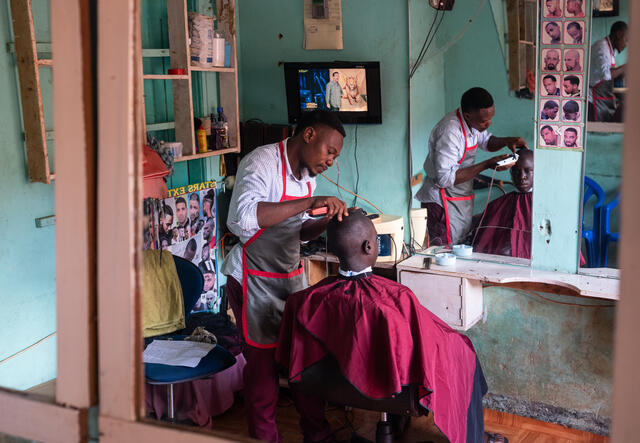 Nelson with a client in his hairdressing salon