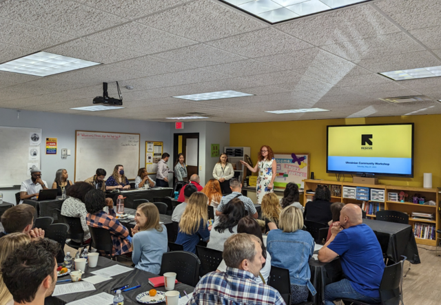 Katya Galytska, Ukrainian Caseworker, addresses the group.