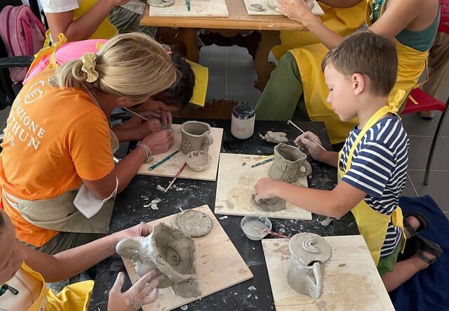 Women and children participating in a Women and Girls' Safe Spaces (WGSS) workshop in Italy