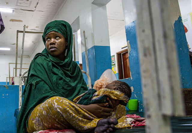 Amina Abukar Abdi and her new born baby meet with doctors in order to be discharged from Hagadera Refugee Camp Hospital Maternity Ward, run by the IRC.