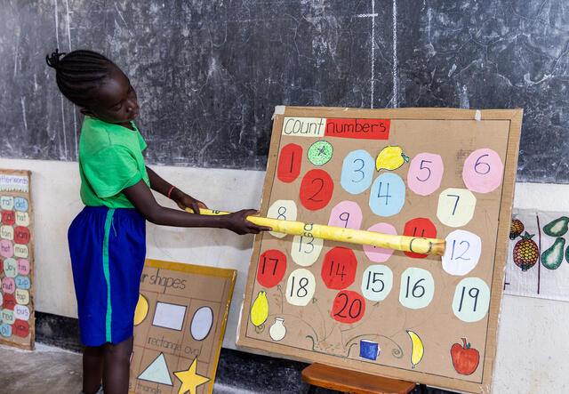 A young girl participates in an active-learning classroom activity during a PlayMatters program