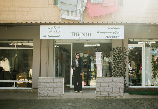 Nour stands outside her store in Chehime, Lebanon.