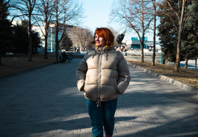 Oleksandra walking down a street