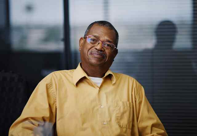 Vital, former refugee from Burundi, poses for photo at the IRC's office in Glendale, Arizona.