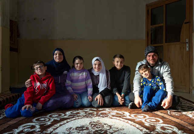 Ameera poses for a photo with her family.