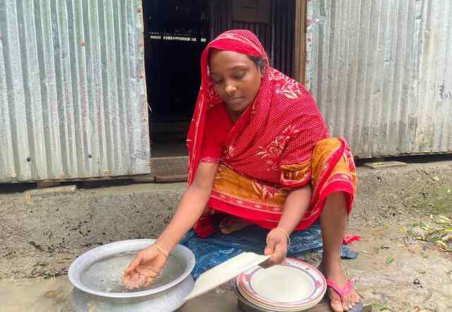 A woman washing her hands