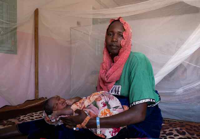 In Gaga refugee camp in Chad, Raouda holds her newborn baby, Abdelrahim. He was born just a few hours earlier at the IRC's health center, which receives funding from the European Union.