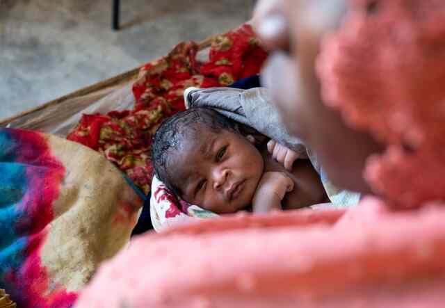 Abdelrahim, healthy, shares one of his first glances with his mother. Following a challenging journey fleeing their homeland, he now embarks on his own chapter of life in Chad, where dedicated IRC teams tirelessly strive to address the protection and nutrition needs of little ones like Abdelrahim.