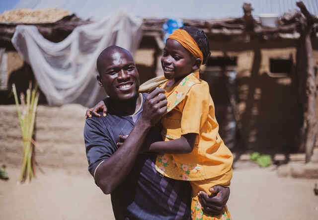 Varvara holding his daughter in his arms