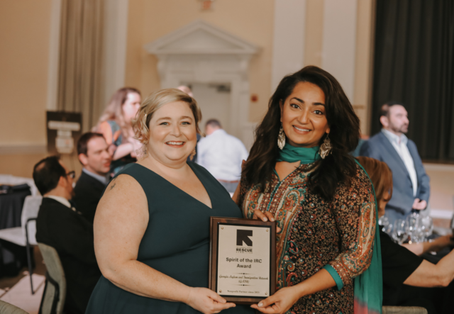 Kate McNeely, Development Director, Alpa Amin, Executive Director - Georgia Asylum and Immigration Network - GAIN - presented with The Spirit of the IRC Award for nonprofit partner