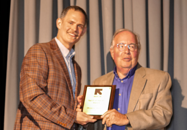 Justin Howell presents Norman Slawsky with the Spirit of IRC Award