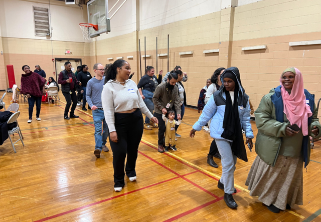 A group of IRC community members doing a line dance