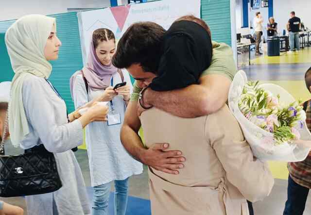 At the airport in Rome Ozair and his family welcomes his father, reuniting the family at last.