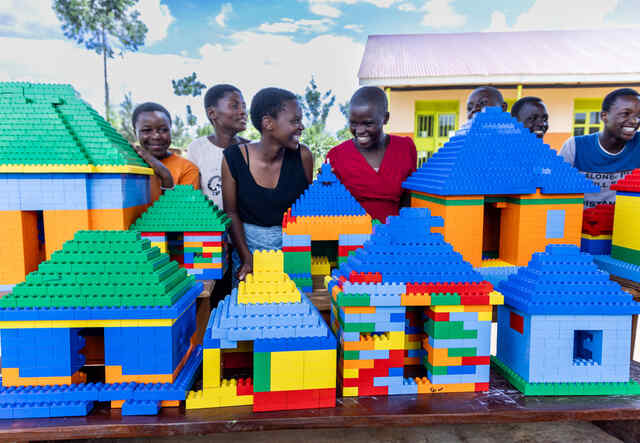 Children with buildings made from Lego taking part in IRC Lego PlayMatters