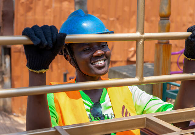 Rahma, 24, shows a piece of furniture she has constructed in Kampala, Uganda.