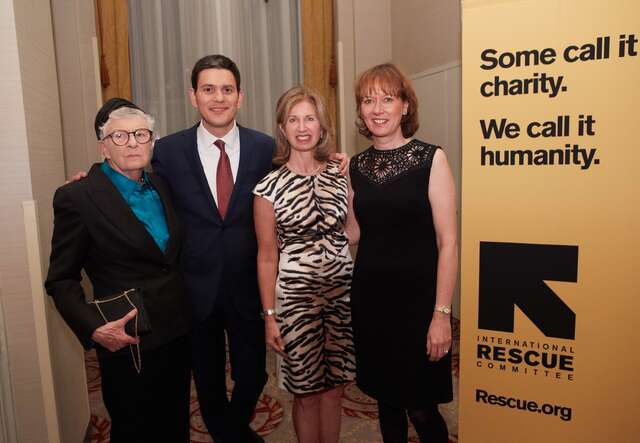 Sheppie, David Miliband, Sarah O’Hagan, and Louise Shackelton pose for a photo in front of an IRC banner.