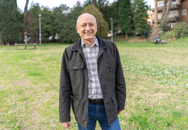 Oleskandr faces the camera, smiling.
