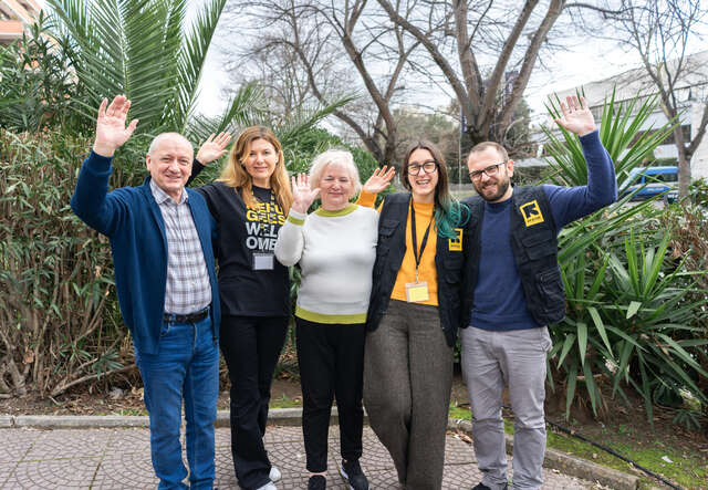 Pictured (from left to right): Oleksandr, IRC case worker Alin, Oleksandr’s wife, case worker Elena, and psychologist Marco.