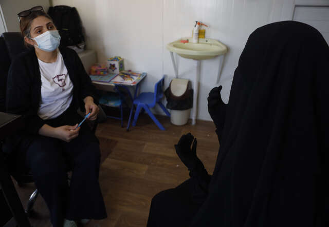 Psychologist Ramia hosts a counseling meeting with Ebtisam.