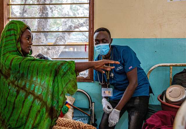 Dr. Silas consults a patient in an IRC health clinic in Kenya.