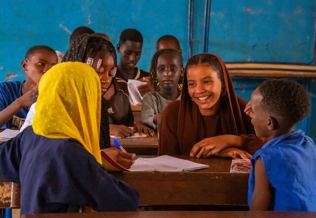 Gao, Mali. Samah, 15, enjoying a cheerful moment with peers at school.