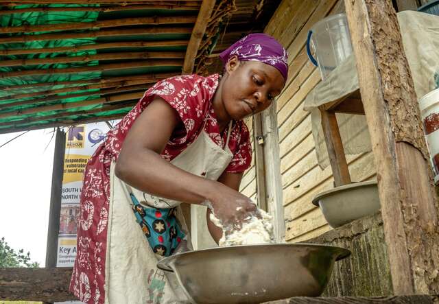 A woman is making bread