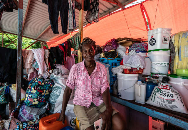 Portrait of a woman sitting in a makeshift shelter outside of Port-au-Prince, Haiti.
