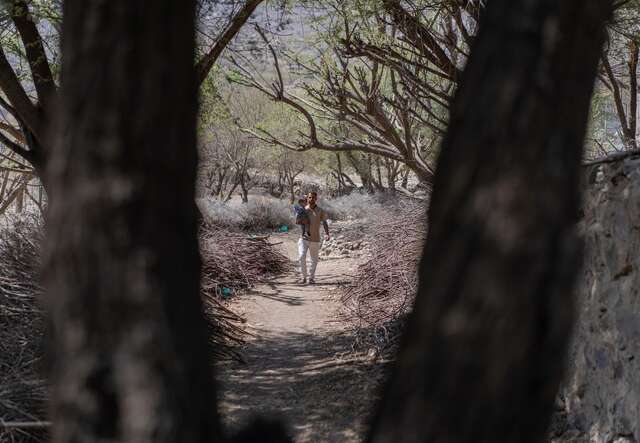 Nader walking his son back home after his check up. 