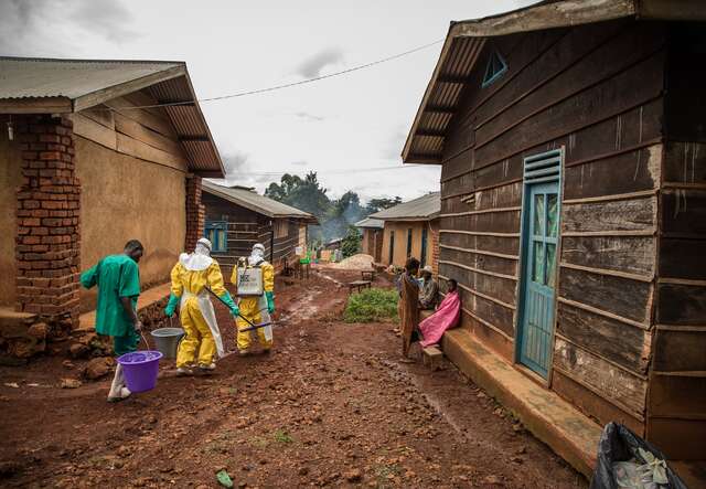 Health workers disinfect a health facility in Mabalako, North Kivu, DRC, during the 2018 Ebola outbreak.