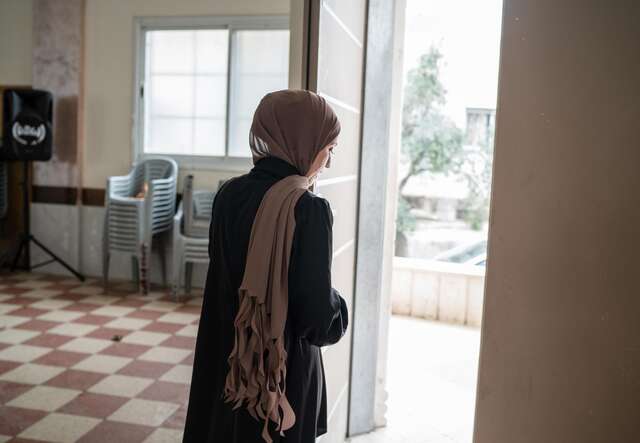 Rana prepares to deliver a first aid training session to a group of community volunteers. 