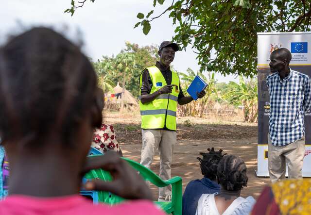 Martin, a volunteer from the community, holds an awareness session.