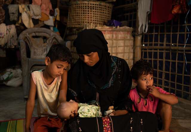 Samira with her three children at home. 