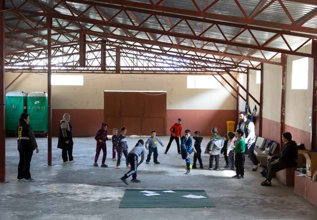Children participate at an IRC psychosocial support session hosted at a collective shelter in Lebanon.