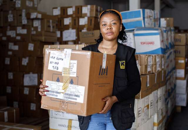 An IRC staff member packs IPC kits at the ASRAMES warehouse in Goma for delivery to Bunia to support health facilities in the prevention and control of Ebola infections. 