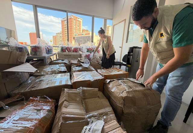 IRC staff pack emergency supplies in boxes for survivors of the earthquakes in Venezuela.